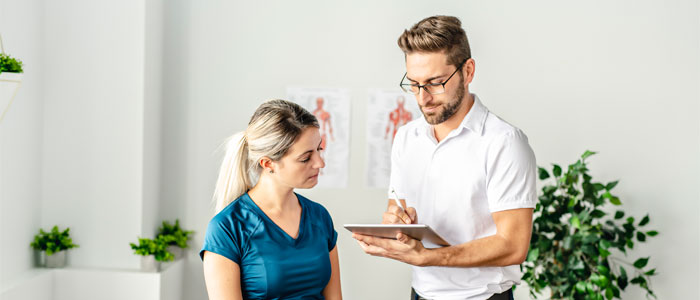 doctor talking to female patient